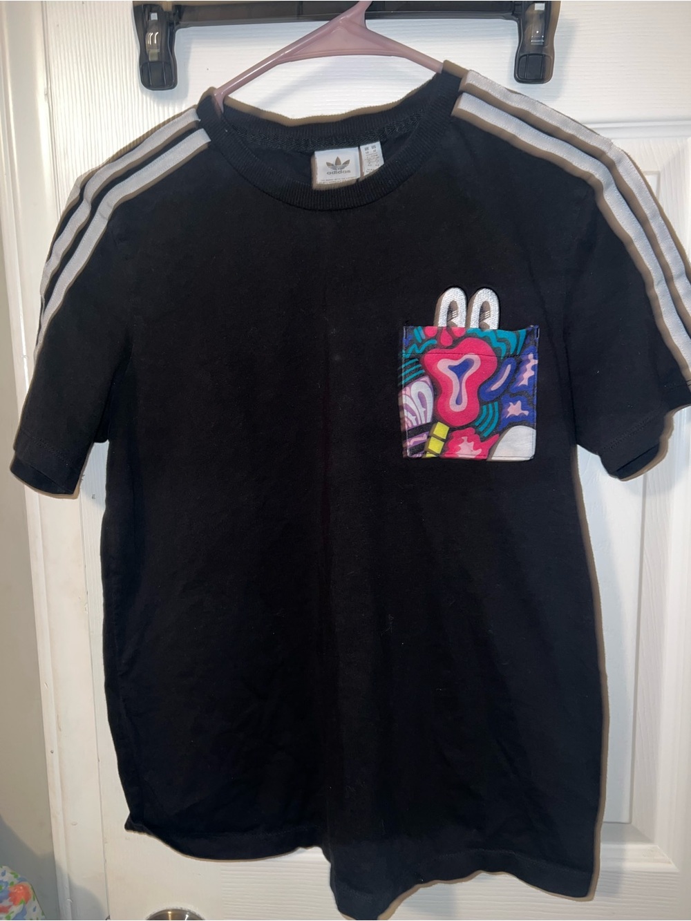 adidas Black Tee with Multicolor Graphic Pocket and White Shoulder Stripes
